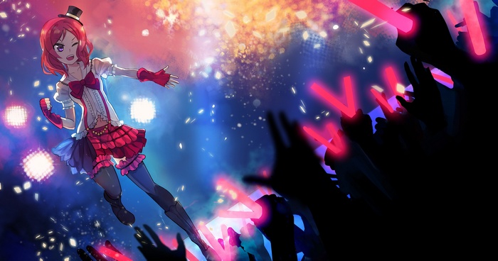 Nishikino Maki performing on stage with glowing sticks