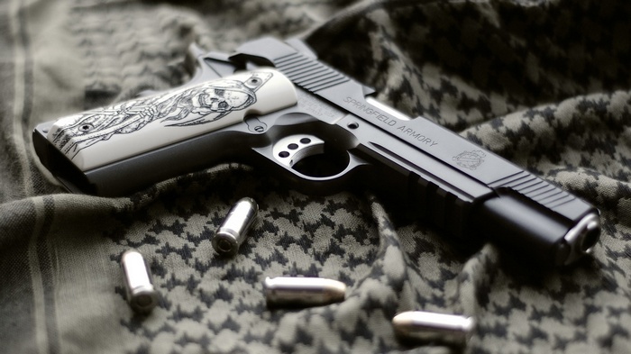 Springfield Armory 1911 pistol with ammunition