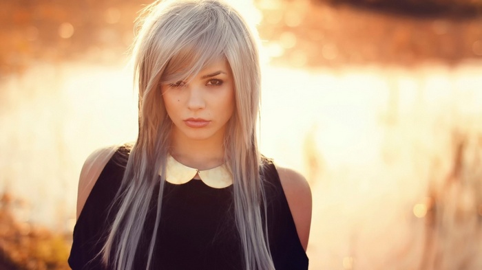 Woman with blonde hair outdoors