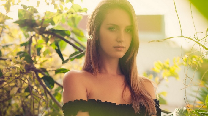 Woman with long brown hair outdoors