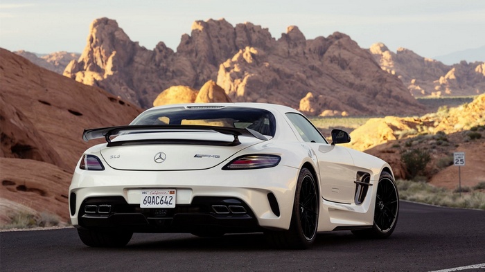 White Mercedes-Benz SLS AMG Black Series in desert landscape