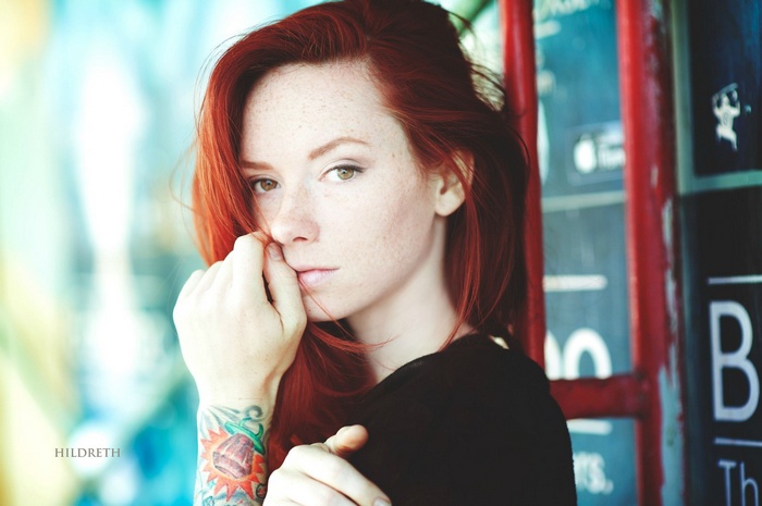 Redhead woman with tattoo by Charles Hildreth
