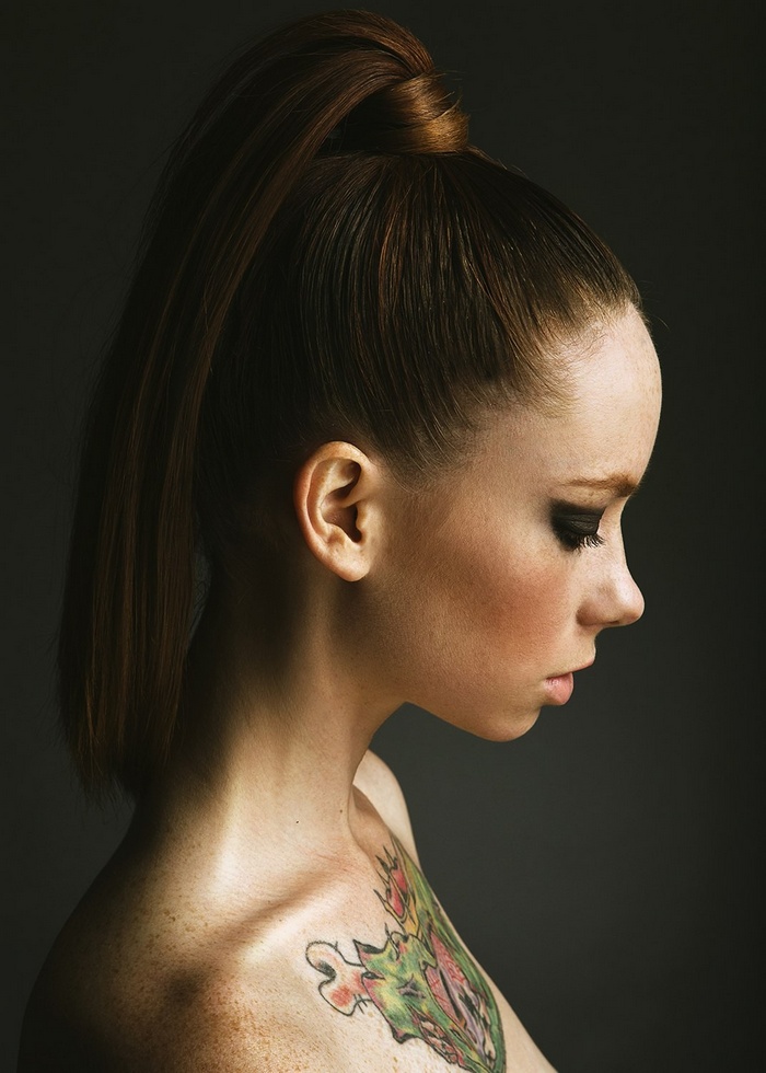 Hattie Watson with freckles and a tattoo