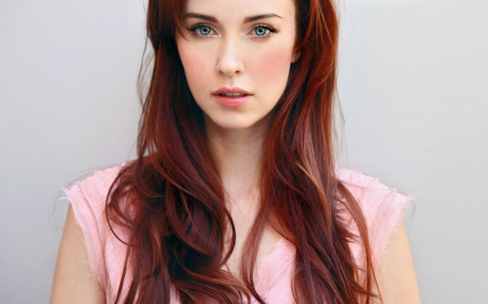Elyse Levesque with red hair and blue eyes