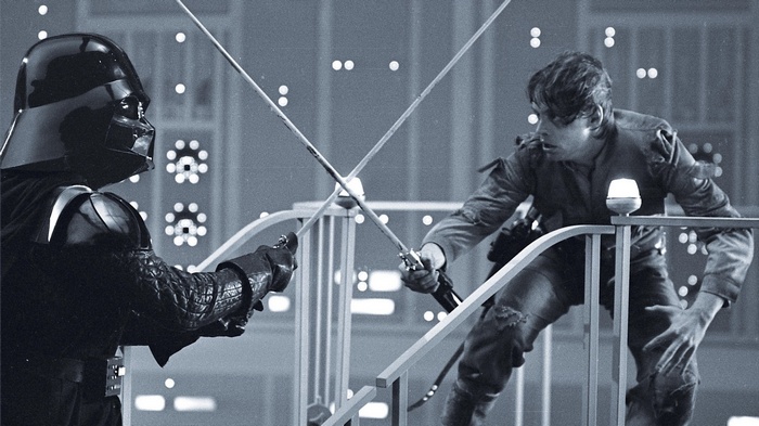 Darth Vader and Luke Skywalker duel with lightsabers