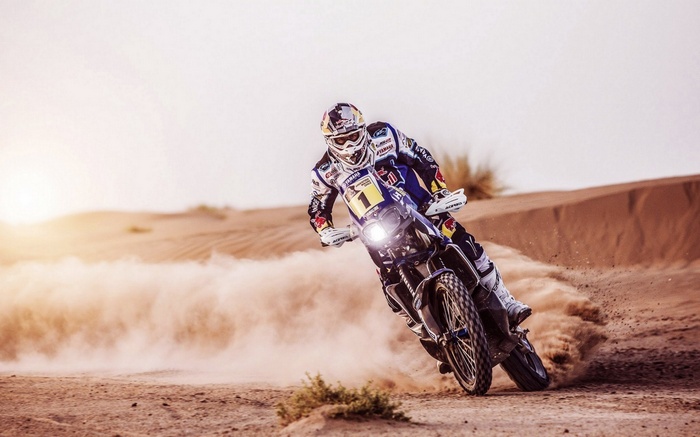 Red Bull motorcycle racer in the desert