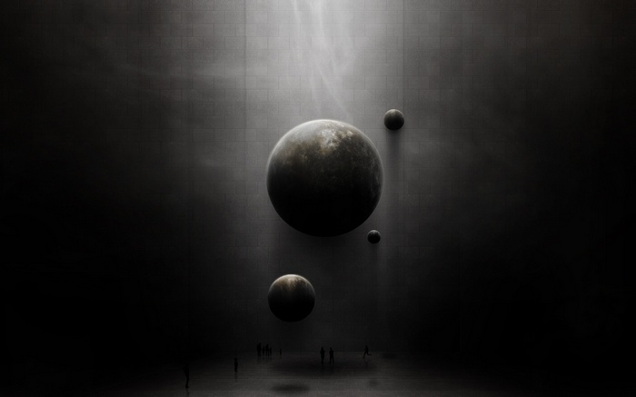 Abstract planets in a dark, textured room