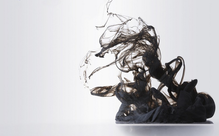 Abstract black ink swirling in water
