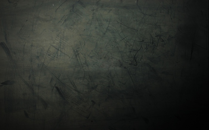 Dark textured surface with scratches