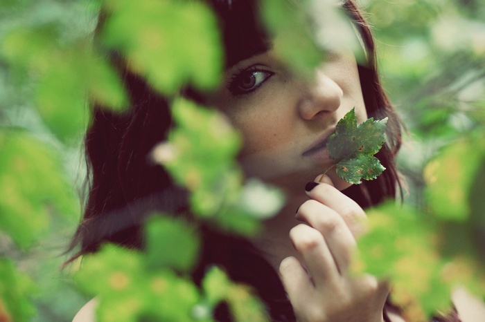 Susan Coffey with a leaf near her mouth