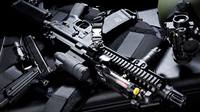 AR-15 and 1911 pistols with tactical gear
