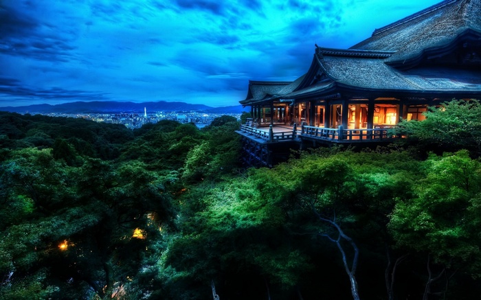 Traditional Japanese temple overlooking Kyoto at dusk