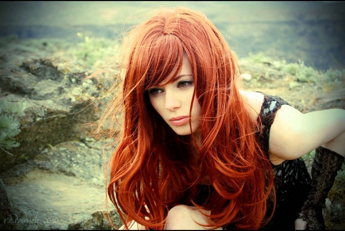 Redhead woman with green eyes outdoors