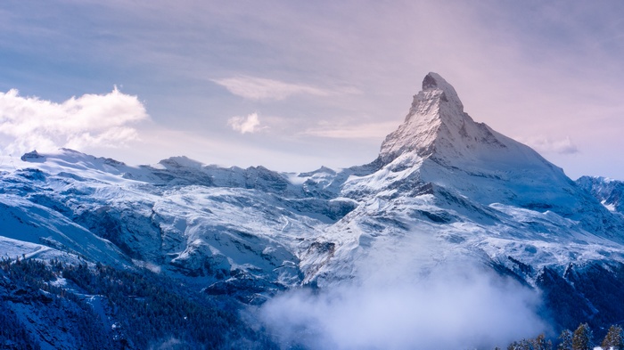 The Matterhorn mountain in the Swiss Alps covered in snow