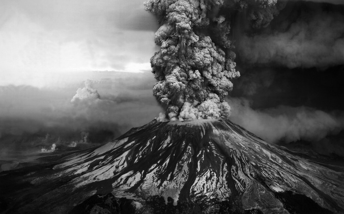 Volcano erupting with a large ash cloud