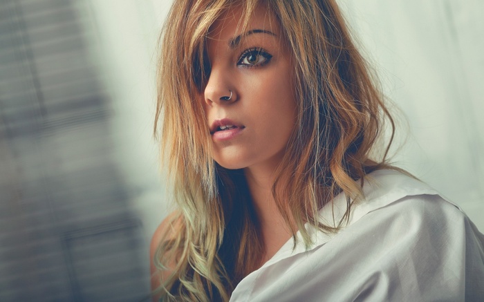 Woman with nose piercing and blonde hair