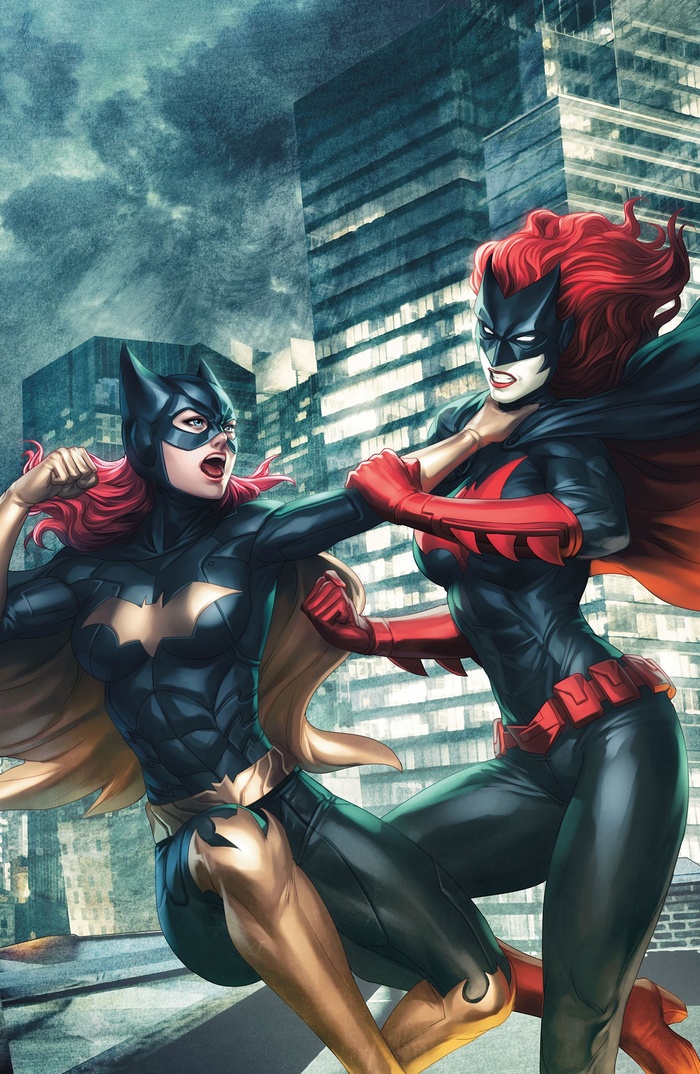 Batgirl and Batwoman fight in a city