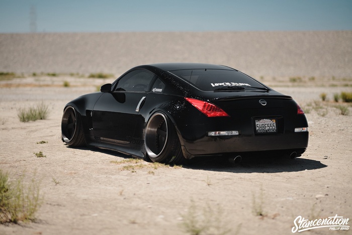 Black Nissan 350Z on a dirt road