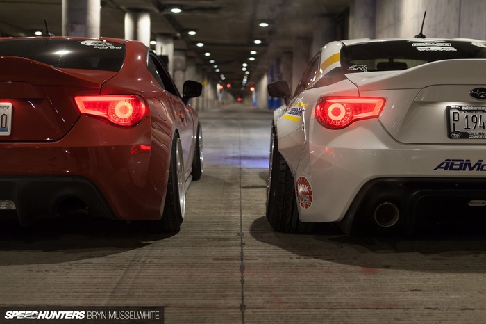Red and White Subaru BRZ cars in a tunnel
