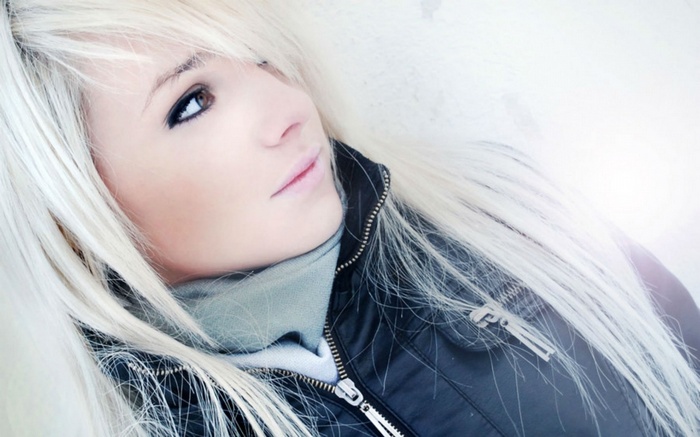 Laura Ivana with white hair wearing a black jacket