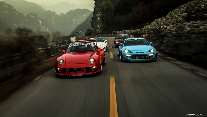 Rauh Welt Porsche and Subaru BRZ cars on a mountain road