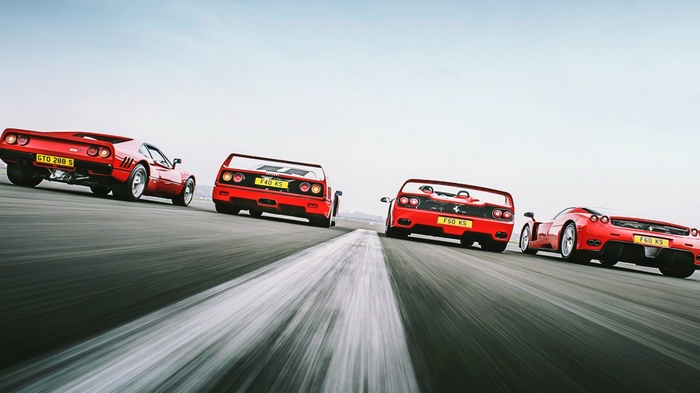 Ferrari 288 GTO, F40, F50, and Enzo on a Racetrack
