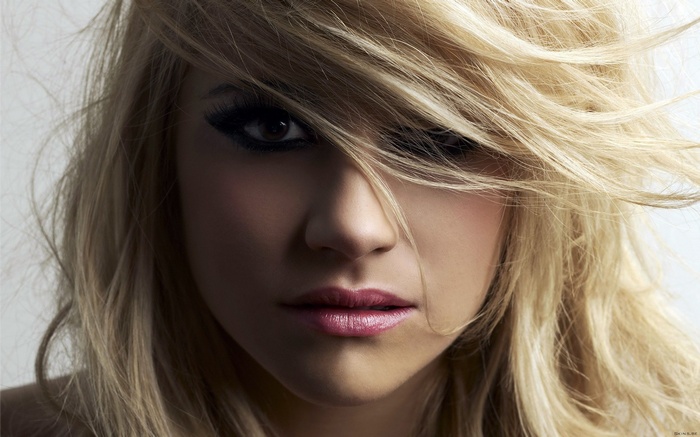 Pixie Lott with blonde hair and makeup
