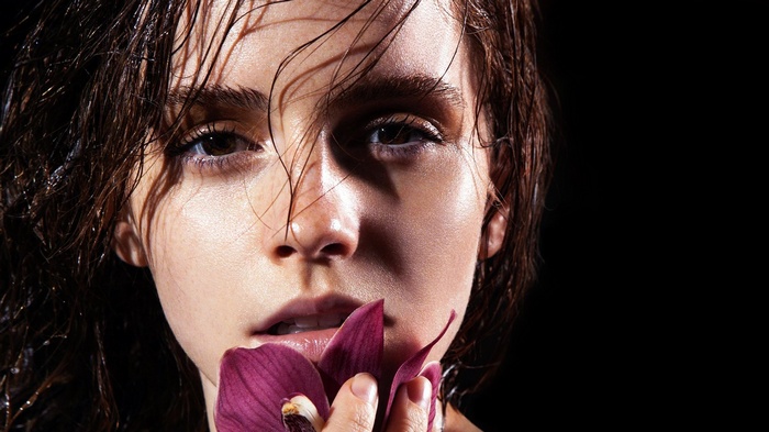 Emma Watson with a purple flower