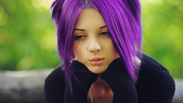 Woman with purple hair and lip piercing