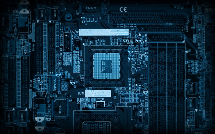 Close-up of a blue computer motherboard with CPU socket