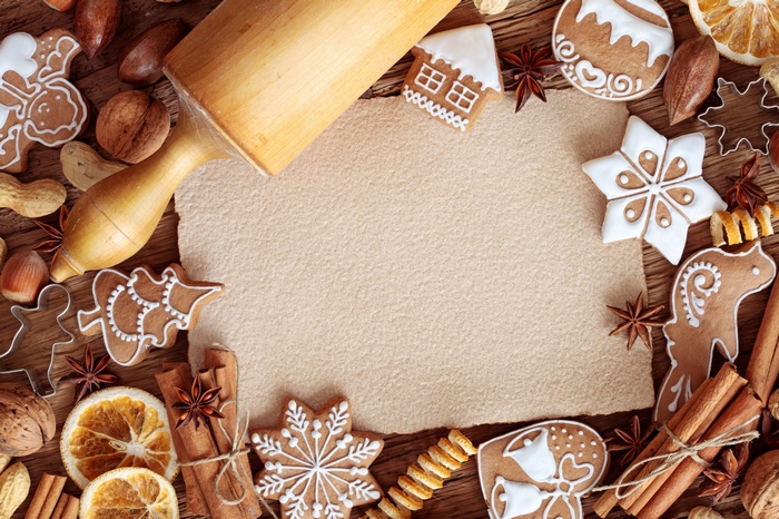 Christmas cookies and rolling pin on a wooden table