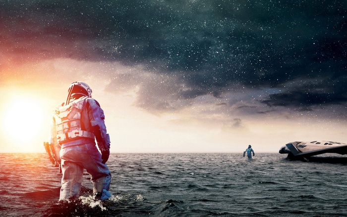 Interstellar movie poster with astronauts in water