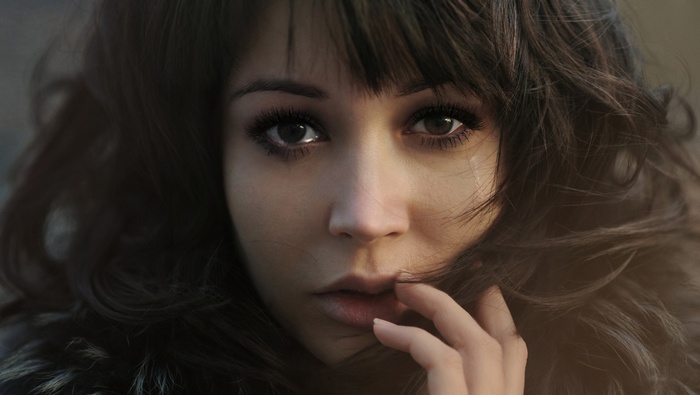 Close-up of a crying woman with dark hair