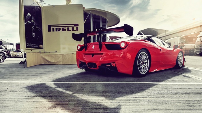 Red Ferrari 458 Italia with Pirelli banner