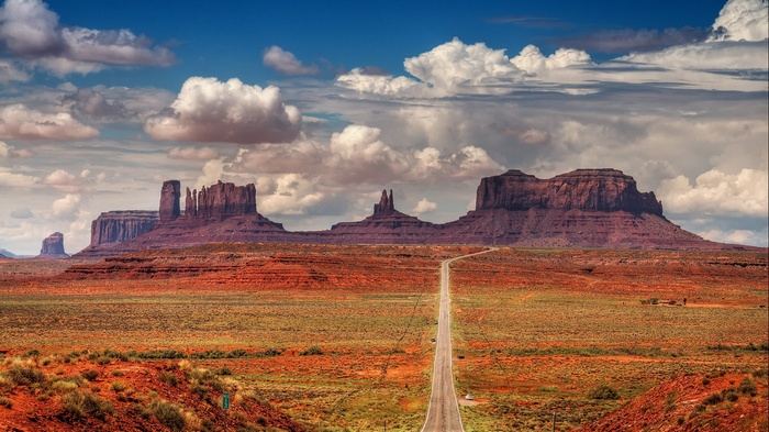 Monument Valley landscape with a road and clouds