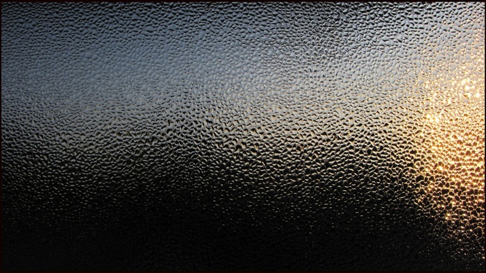 Abstract textured glass with sunlight