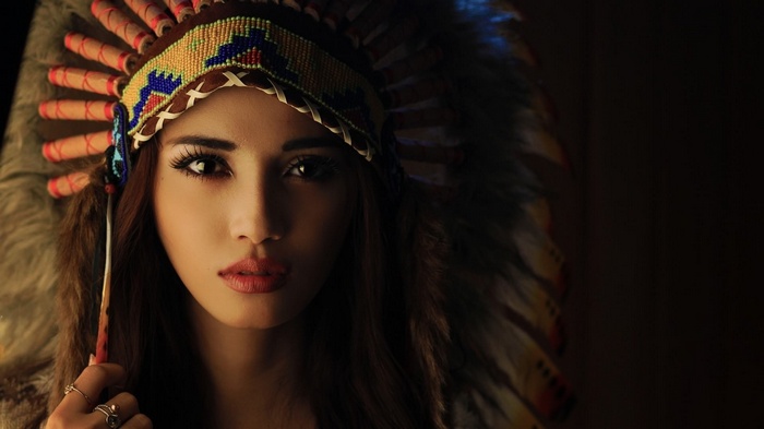 Woman wearing a Native American headdress