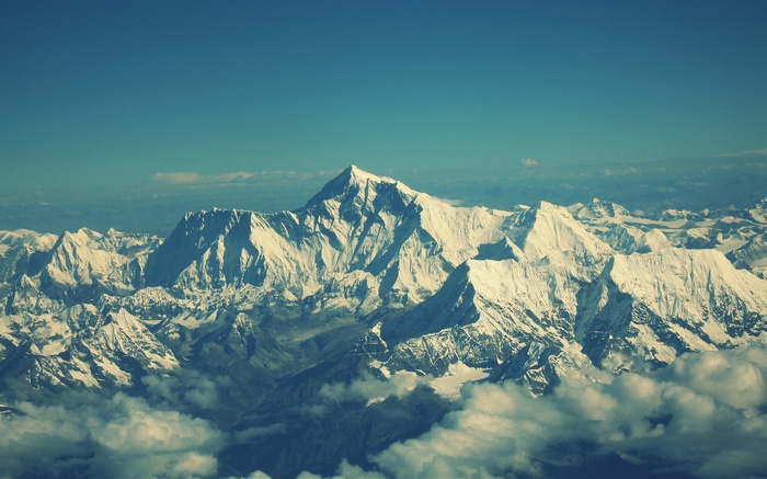 Snow-capped mountains under a clear blue sky