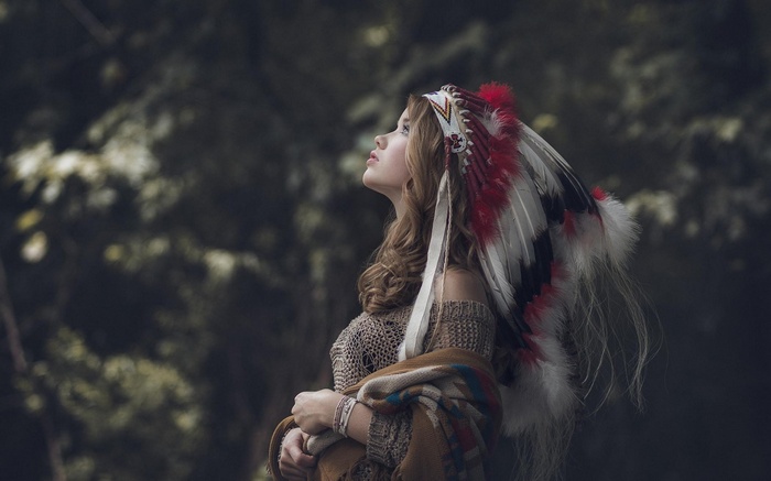 Woman wearing a Native American headdress