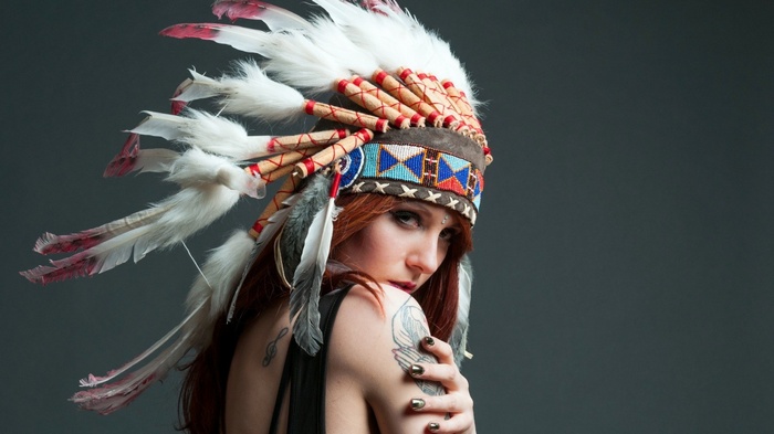 Woman with Native American Headdress and Tattoos