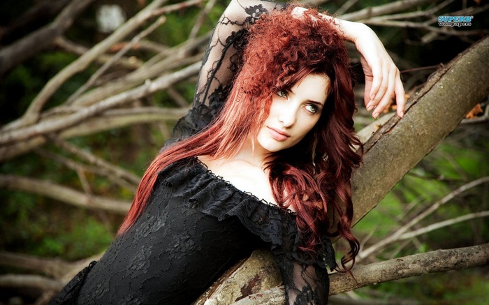 Susan Coffey in a black dress outdoors