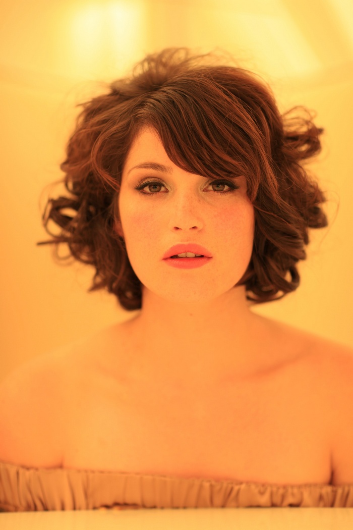 Gemma Arterton with curly brown hair