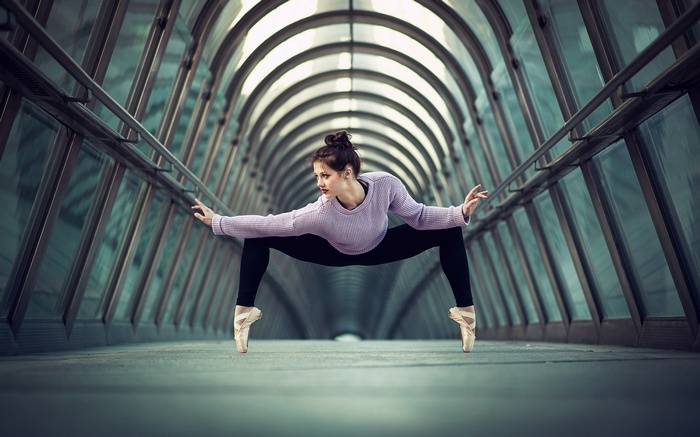 Ballerina in a modern tunnel
