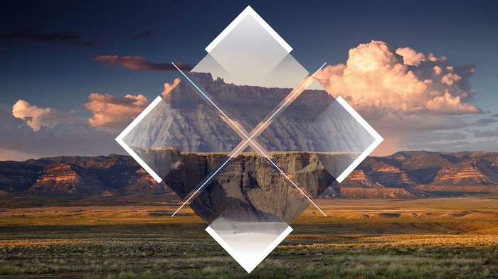 Geometric overlay on a mountain landscape at sunset