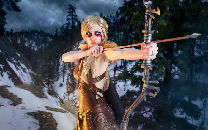 Skyrim Cosplayer with Bow and Arrow in Snowy Forest