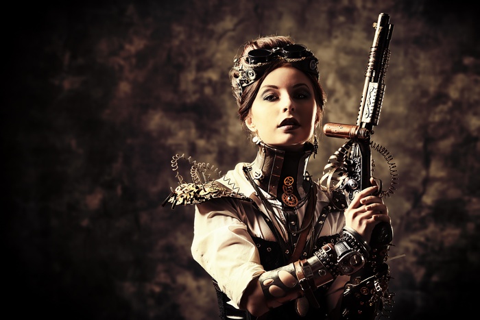 Steampunk woman with goggles and a rifle