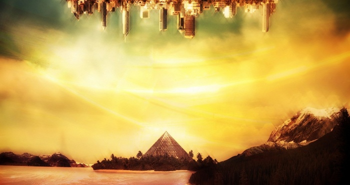 Upside down cityscape above a pyramid and mountains