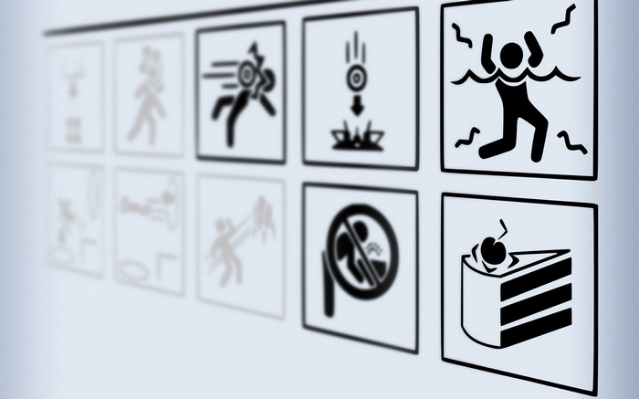 Portal game icons including cake and danger signs