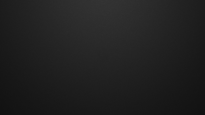 Dark textured surface with subtle lighting