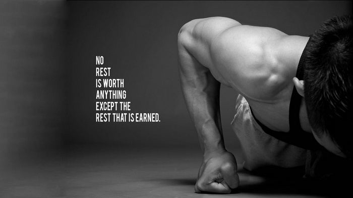 Man doing push-ups with motivational quote